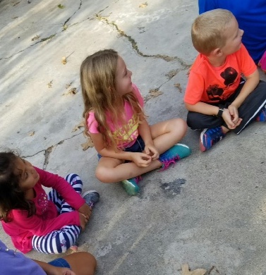 Kids playing on the sidewalk
